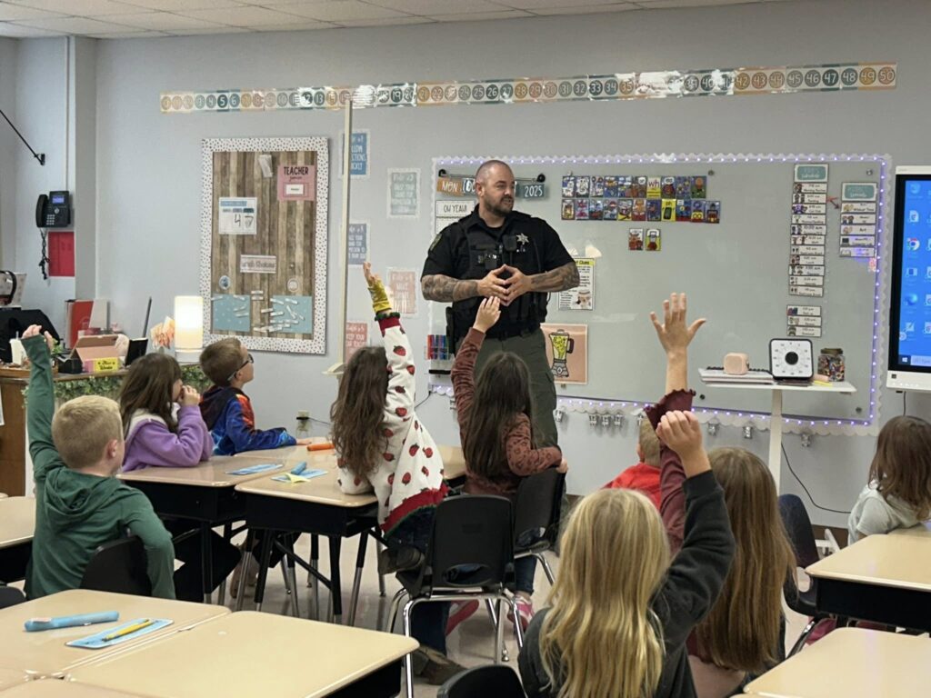 Kindergarten and 1st grade students received safety instruction from Deputy Boeger, covering seat belts, booster seats, back seat safety, and Halloween precautions.